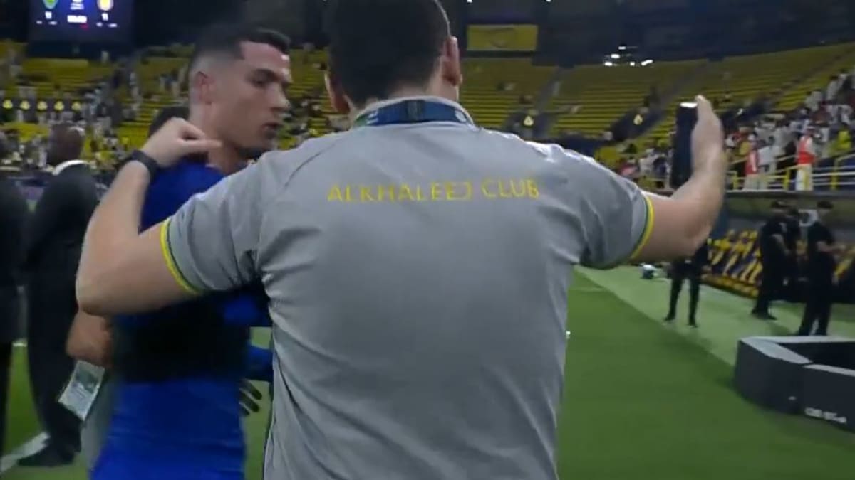 A opposition player who was attempting to take a photo was pushed by Ronaldo. 1